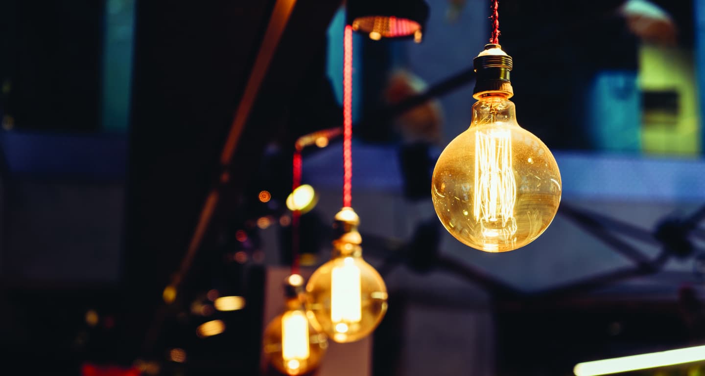 A group of light bulbs hanging from the ceiling.