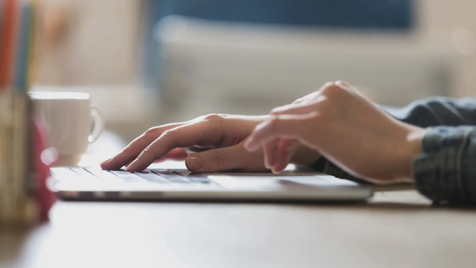 person typing on a laptop